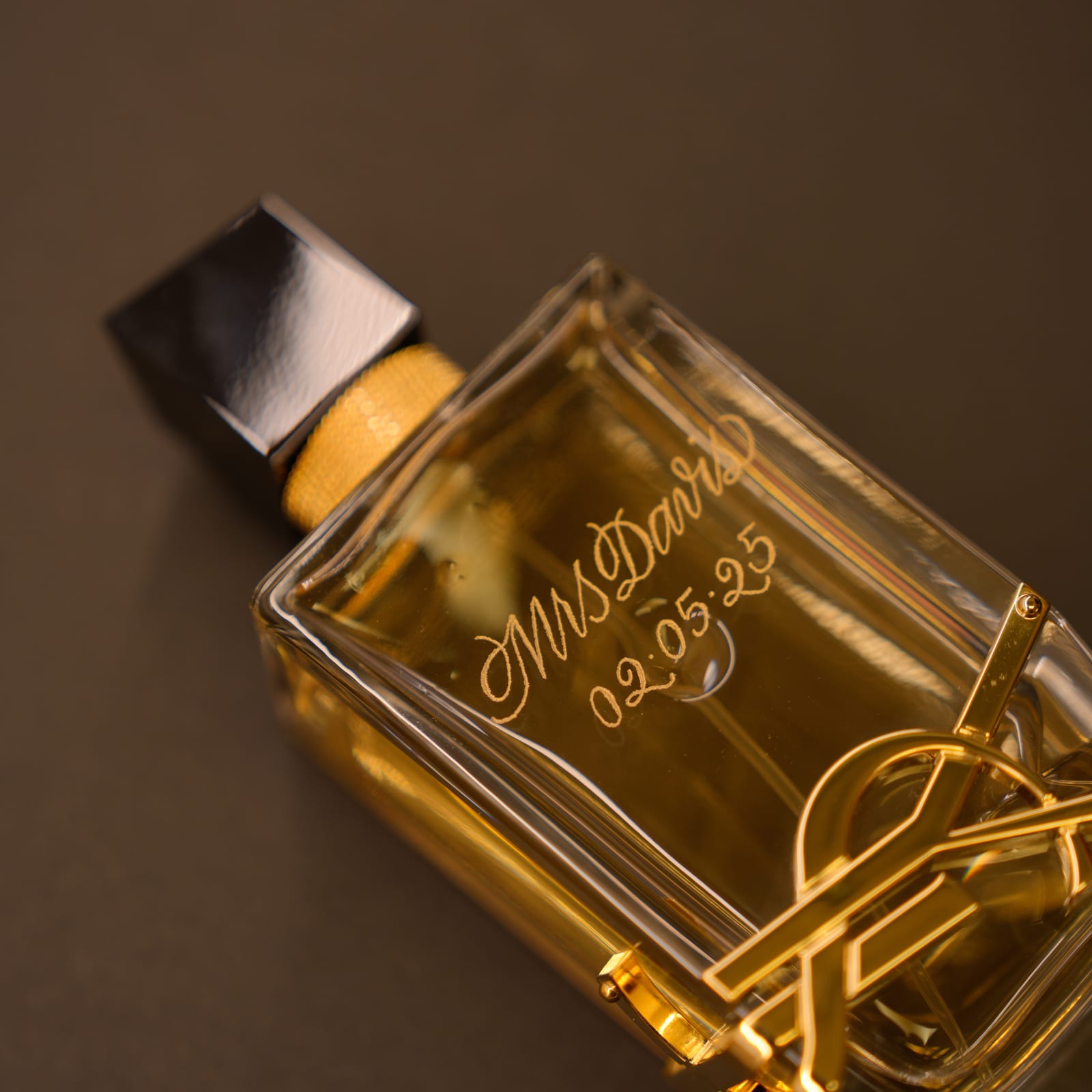 Glass perfume bottle engraving detail