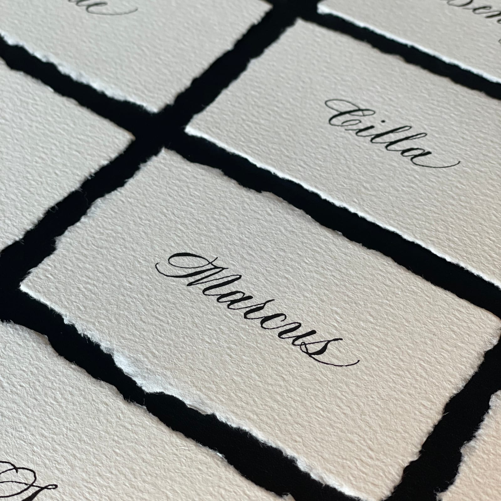 Deckle edge wedding place card calligraphy