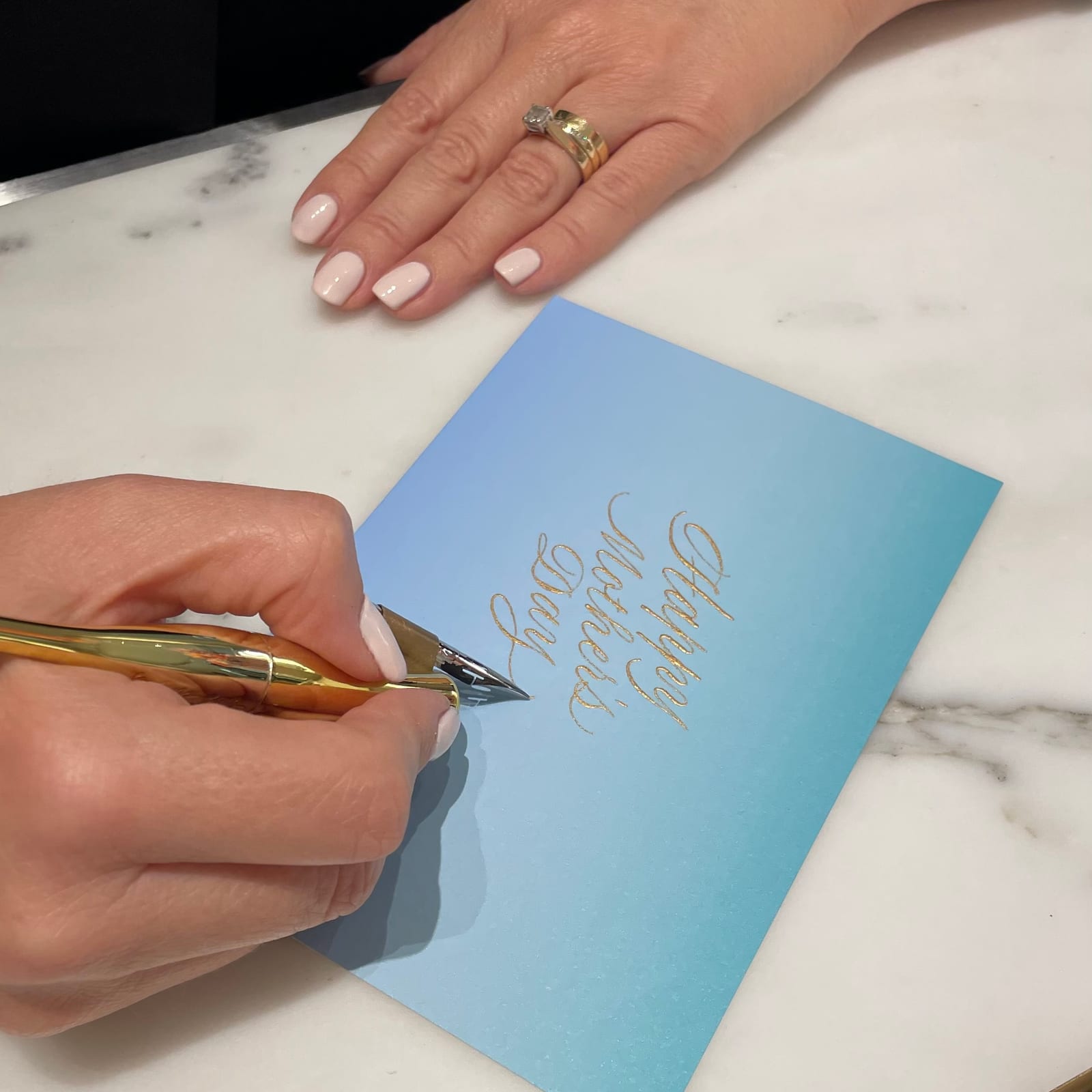 Pointed-pen Mother's Day calligraphy on Tiffany-blue stationery at Pacific Fair