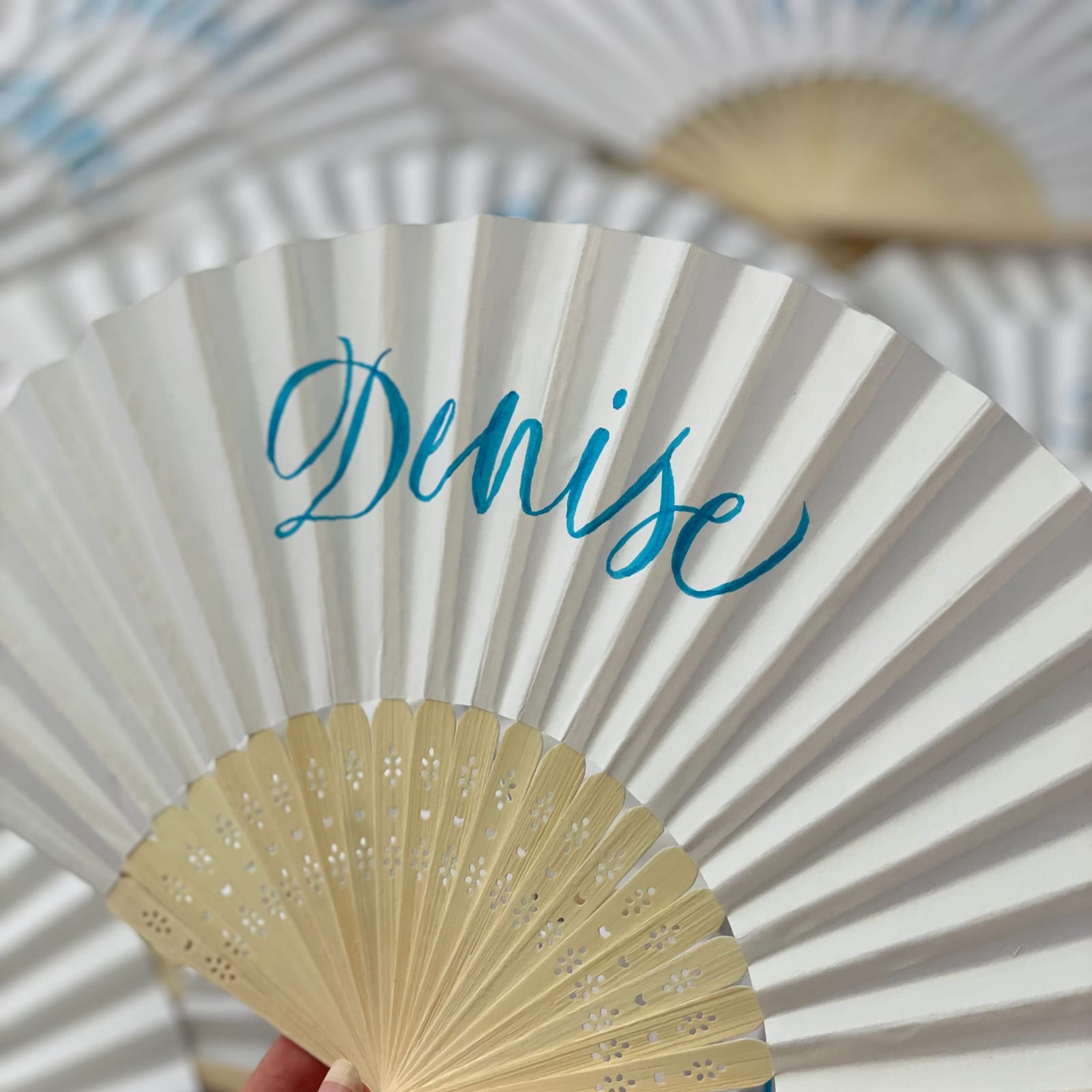 Personalised paper fans for wedding guests