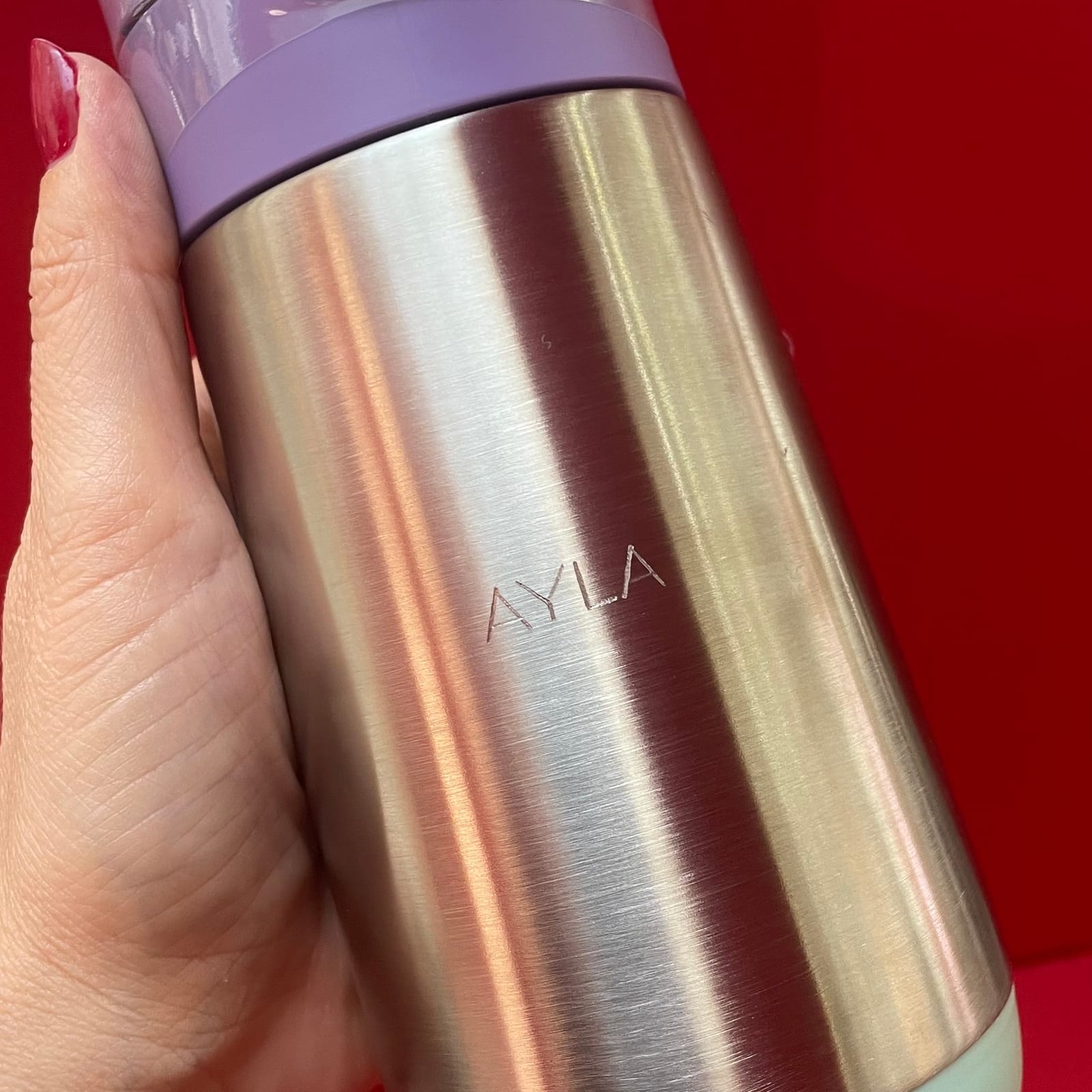 Sans serif name engraving on a stainless steel water bottle