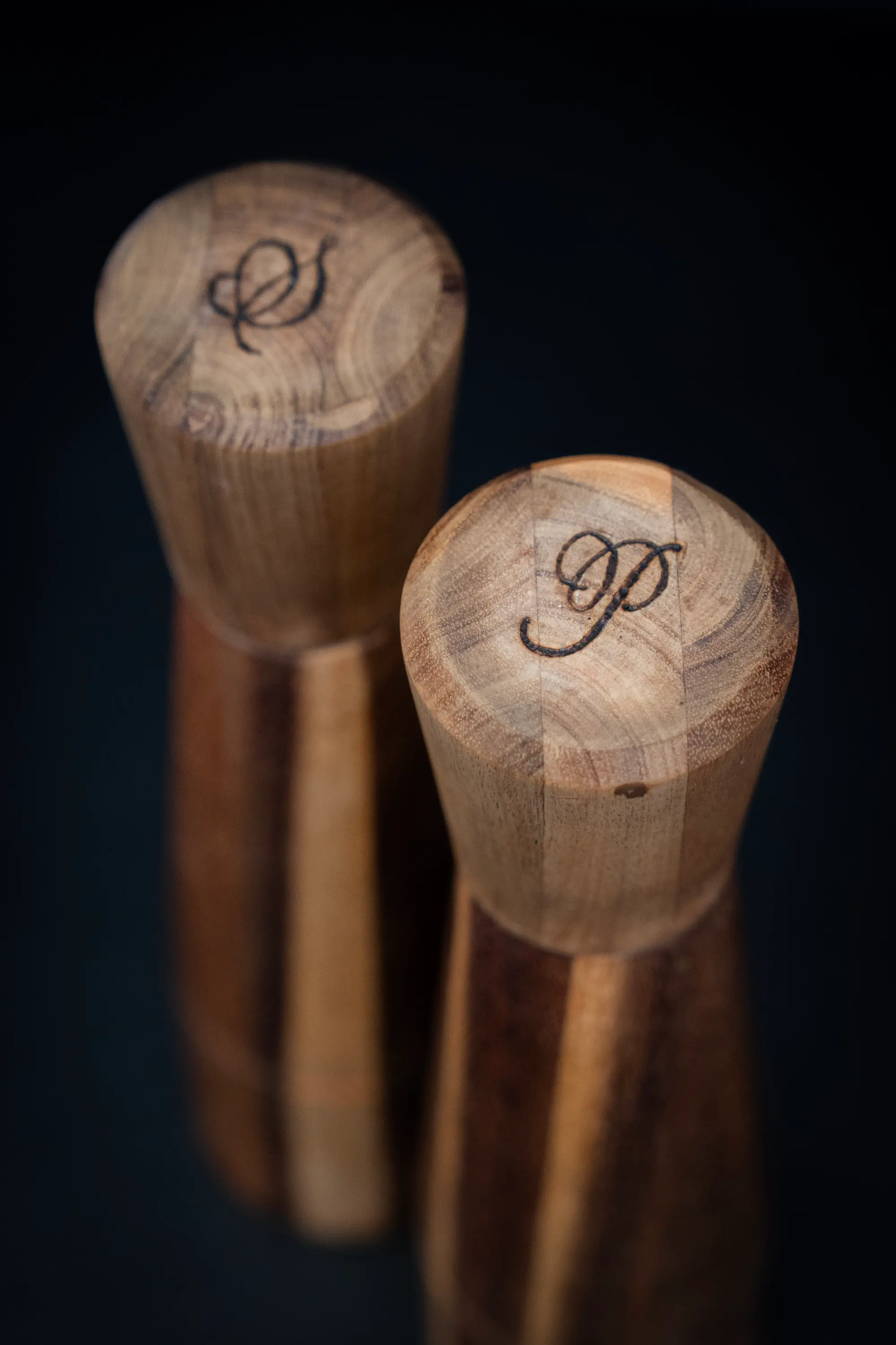Wood burning pyrography on timber salt and pepper grinders